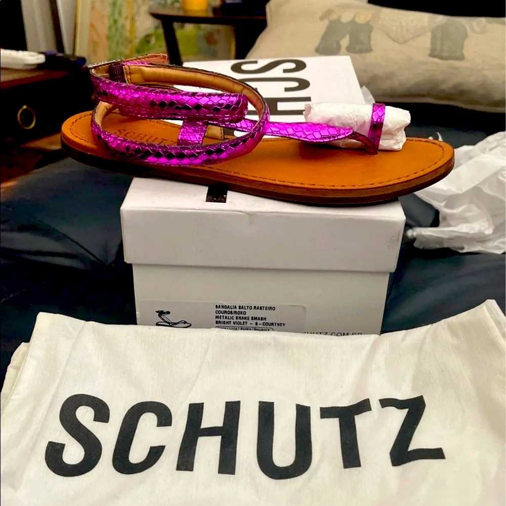 Brand new size 6B womens Schutz bright violet snakeskin sandal. Never worn.